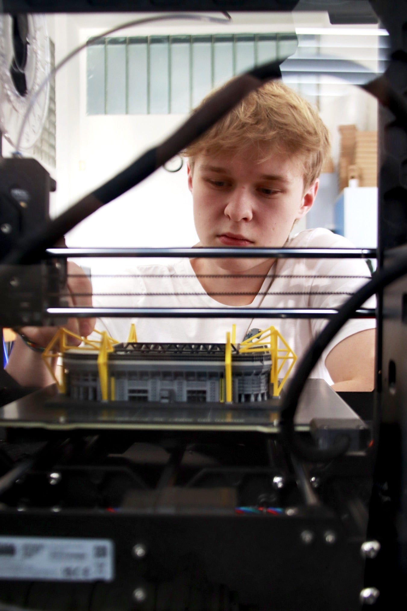 A detailed stadium model inside a StadiArt 3D printer